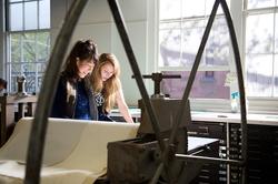 Two people at work in Benson Hall on RISD's campus.