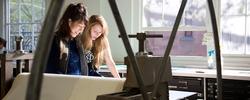 Two people at work in Benson Hall on RISD's campus.