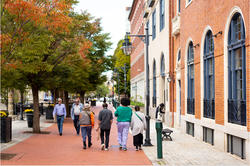 A group of people walk together in RISD's campus area of downtown Providence.